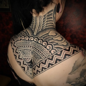 ornamental backpiece tattoo